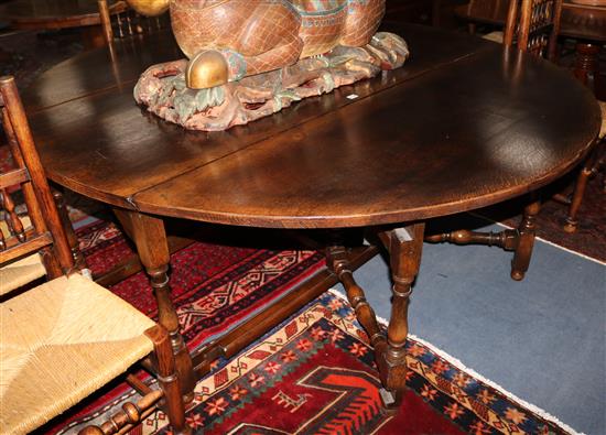An oak gateleg table, W180cm
